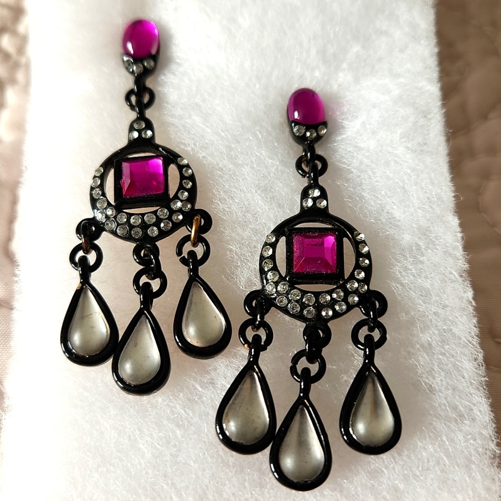 Chandelier earrings with white, silver and purple stones. Black trim